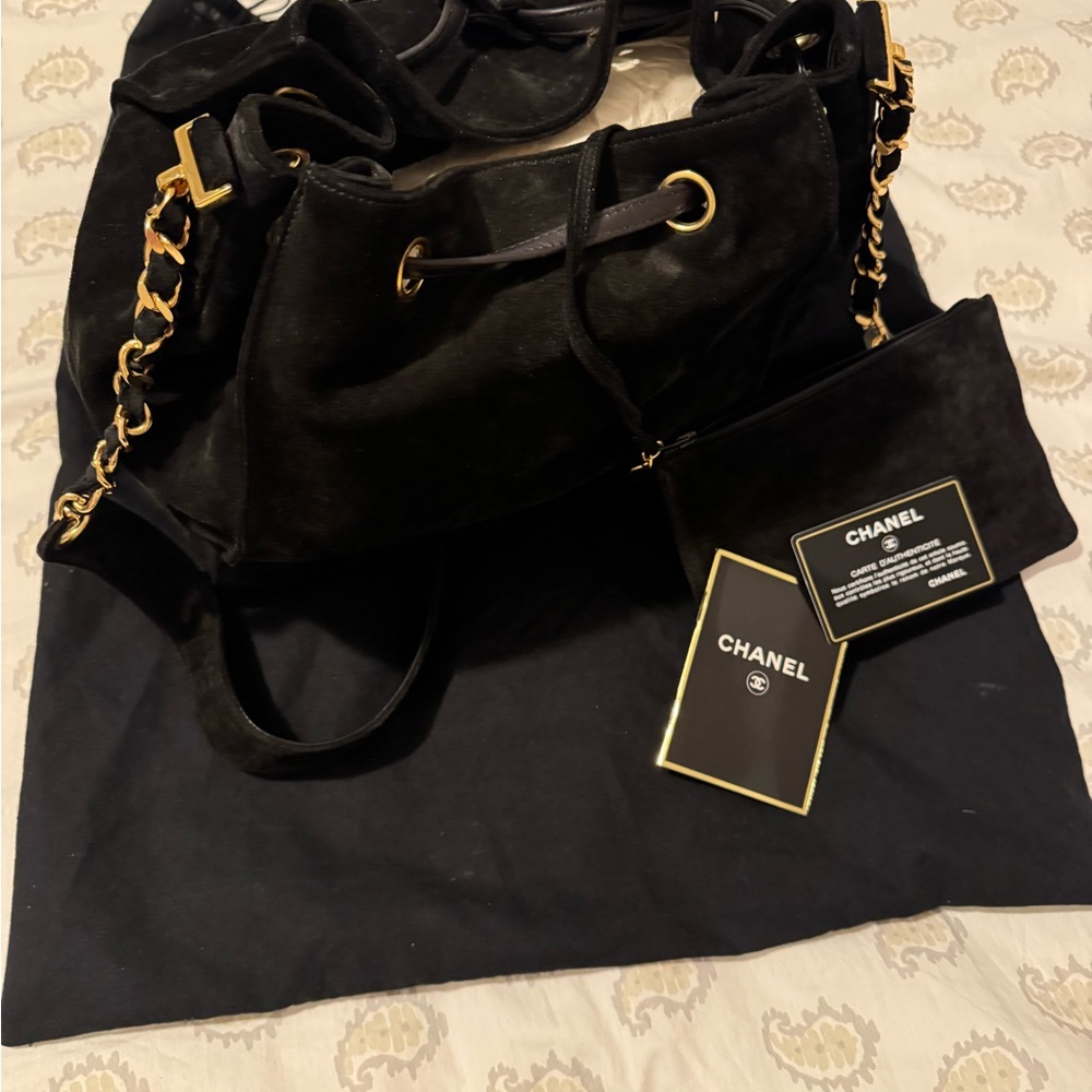 CHANEL Black Suede Drawstring bag with stitched CC Logo & 24k Gold dipped Chain